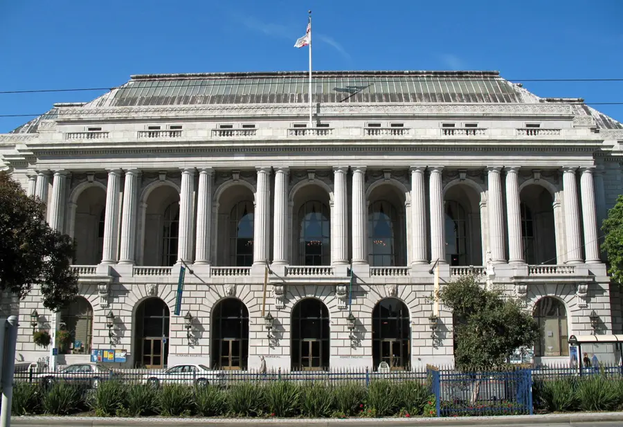 The War Memorial Veterans Building on Van Ness Avenue, with the Green Room’s tall arched windows and chandeliers on the second floor behind the colonnade